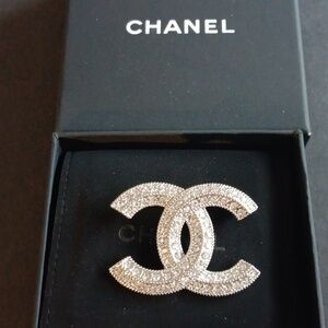 CHANEL Sparkling Silver Crystal Pin. So In Style.